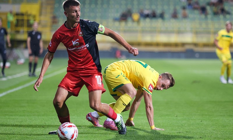 Competitive match action involving a club player